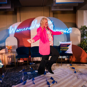 Silvia Mah dancing on Women's Venture Summit stage